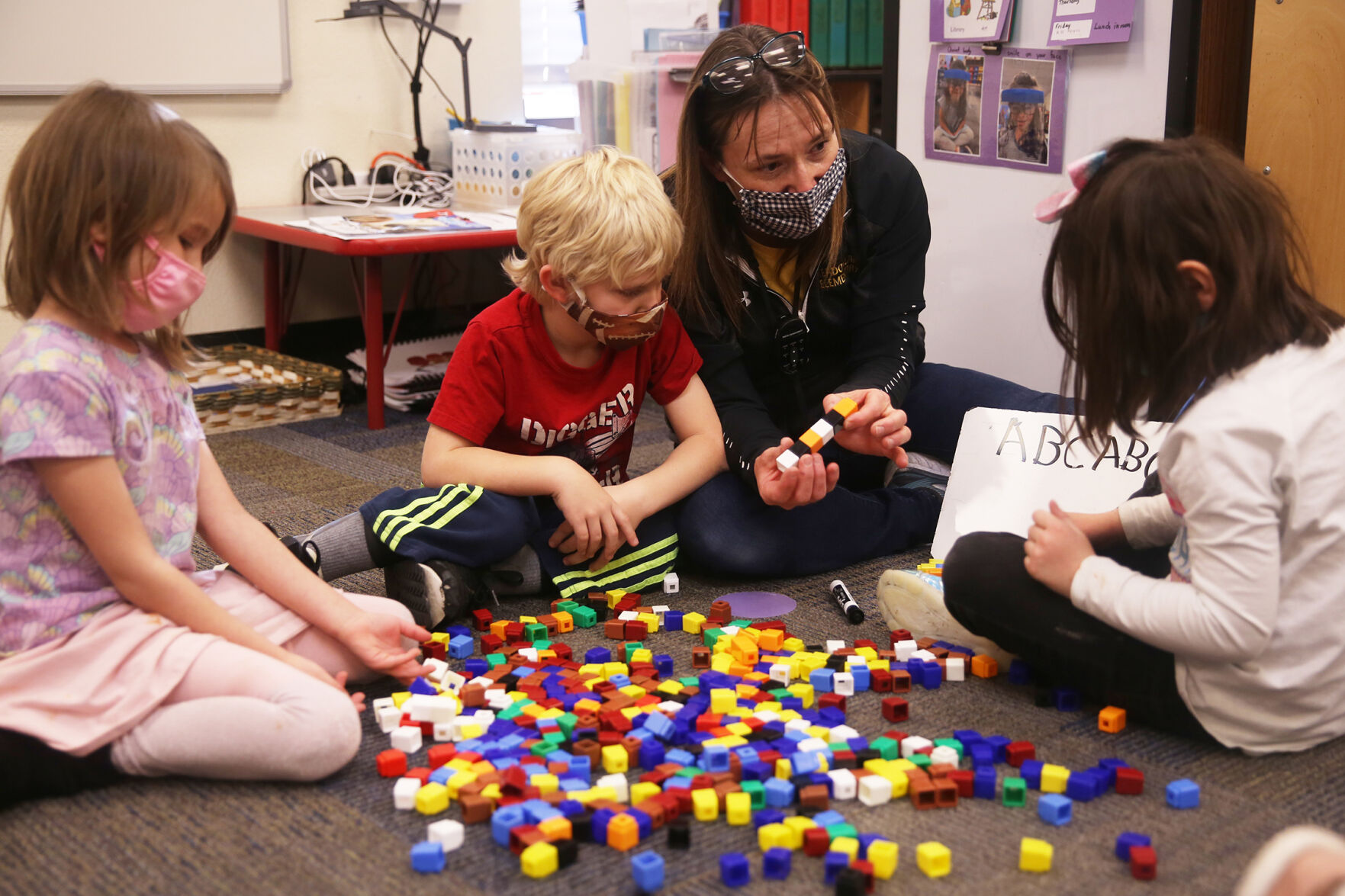 Astrid Crashley, Johnathan Finkle and Harlie Sullivan stack their blocks